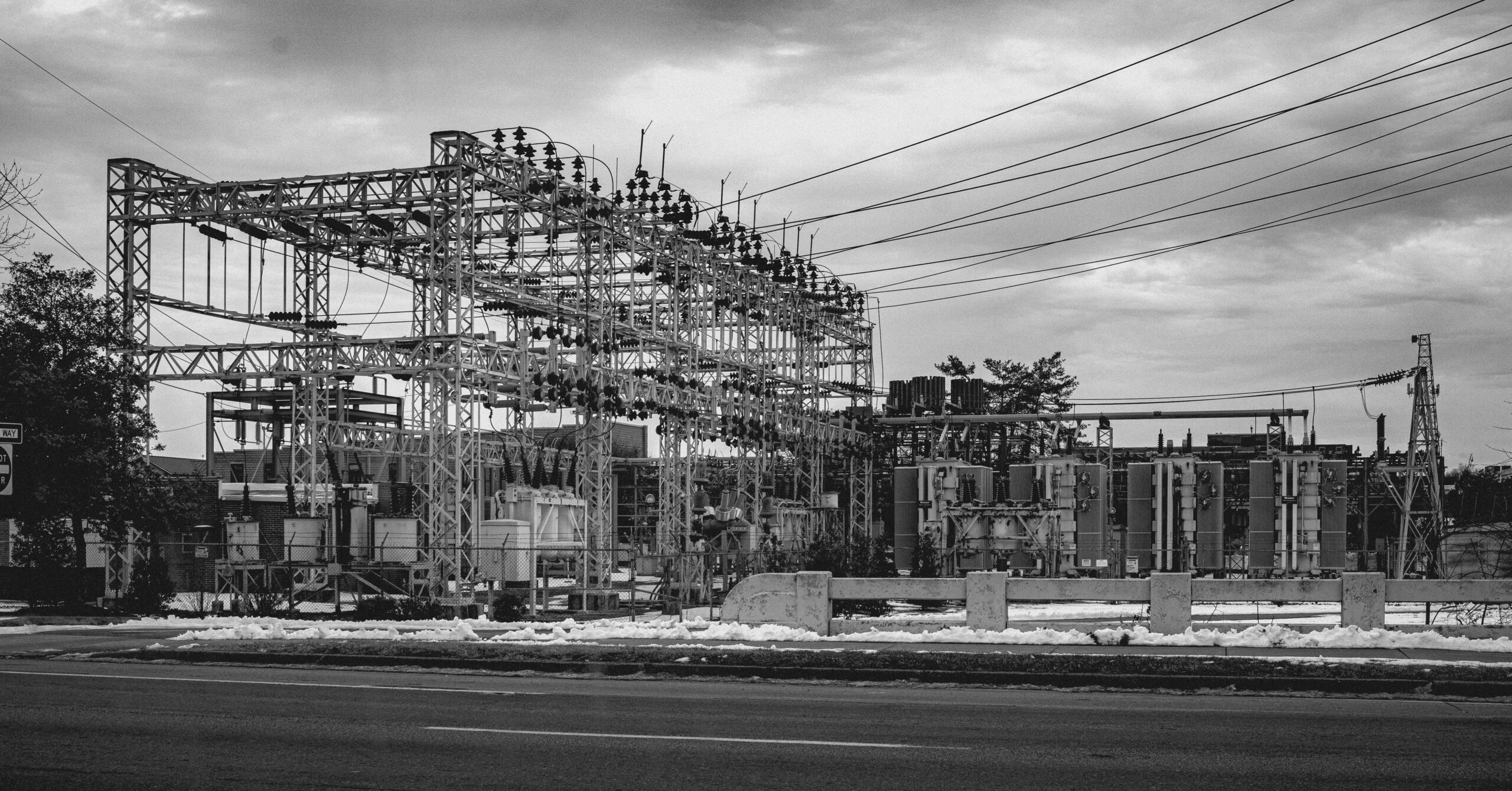 Black and white photo of an electric power station in Bristol, Tennessee, with snowy foreground.
